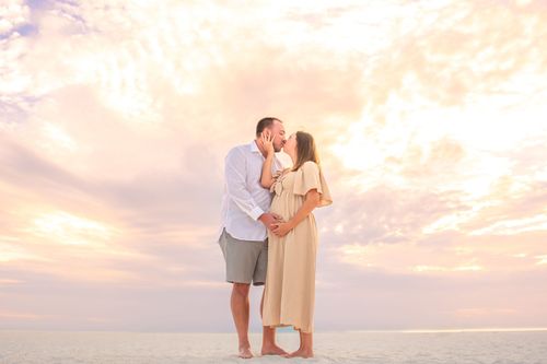 maternity photo of couple at beach sunset for a photography portfolio