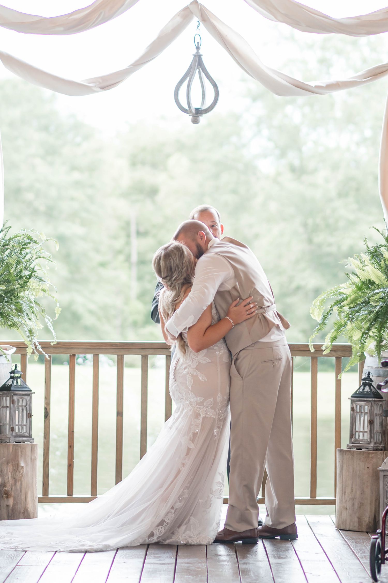 bride and groom kiss during ceremony