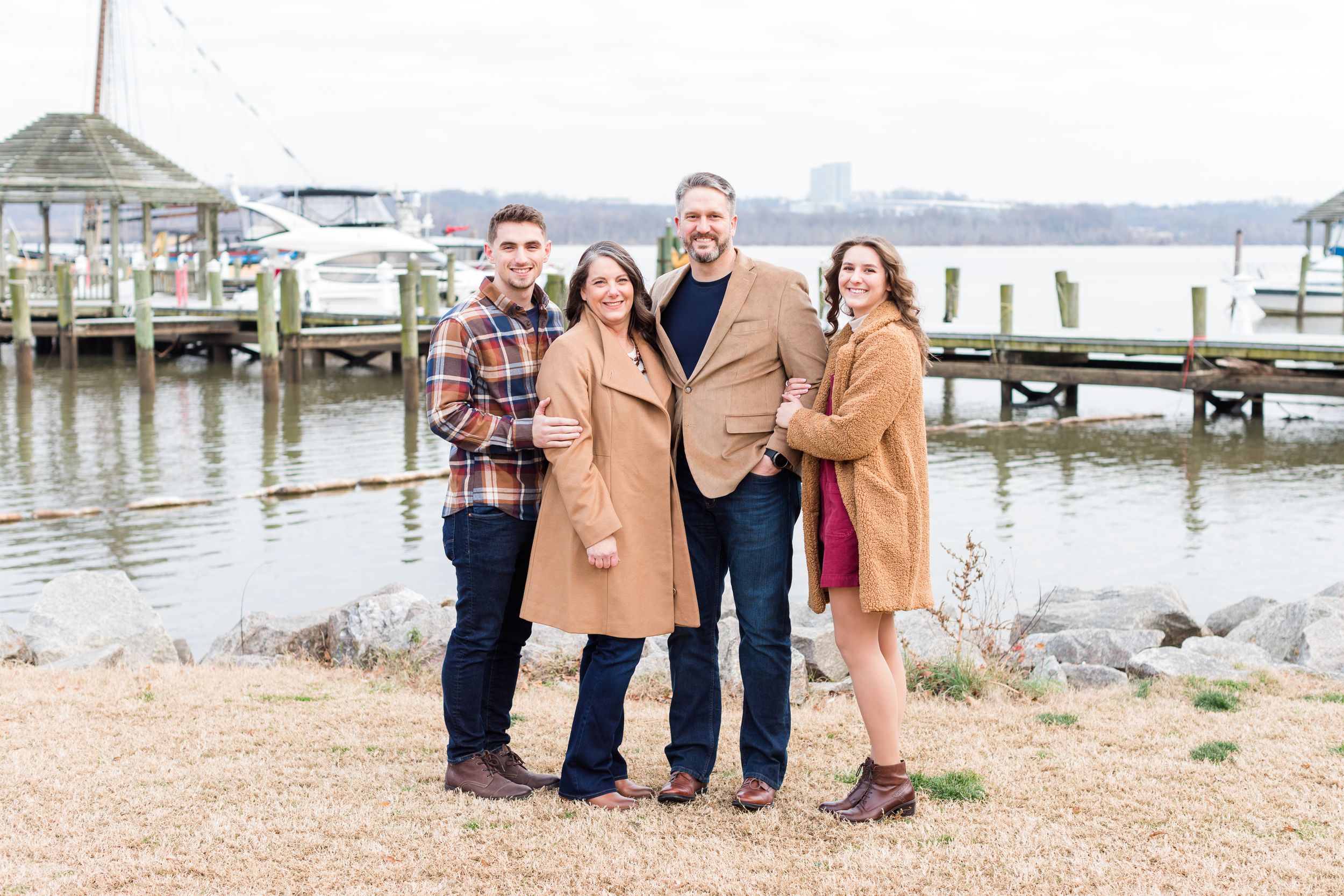 Family posing in Old Town Alexandria waterfront in winter