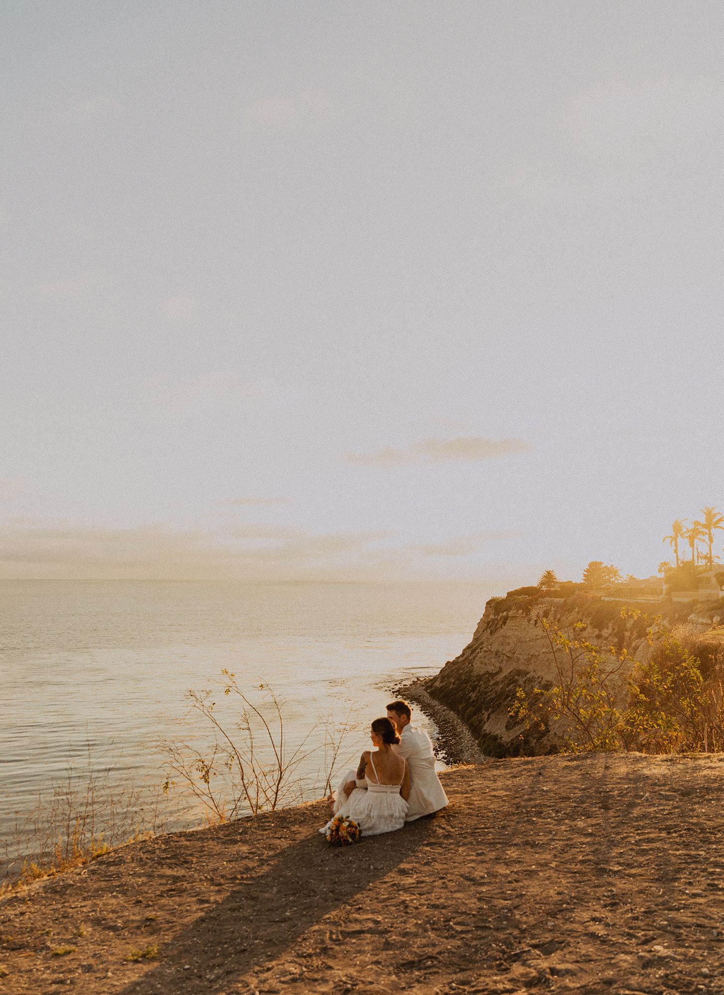 Bride and groom couple's portraits after a Palos Verdes cliffs wedding overlooking the ocean