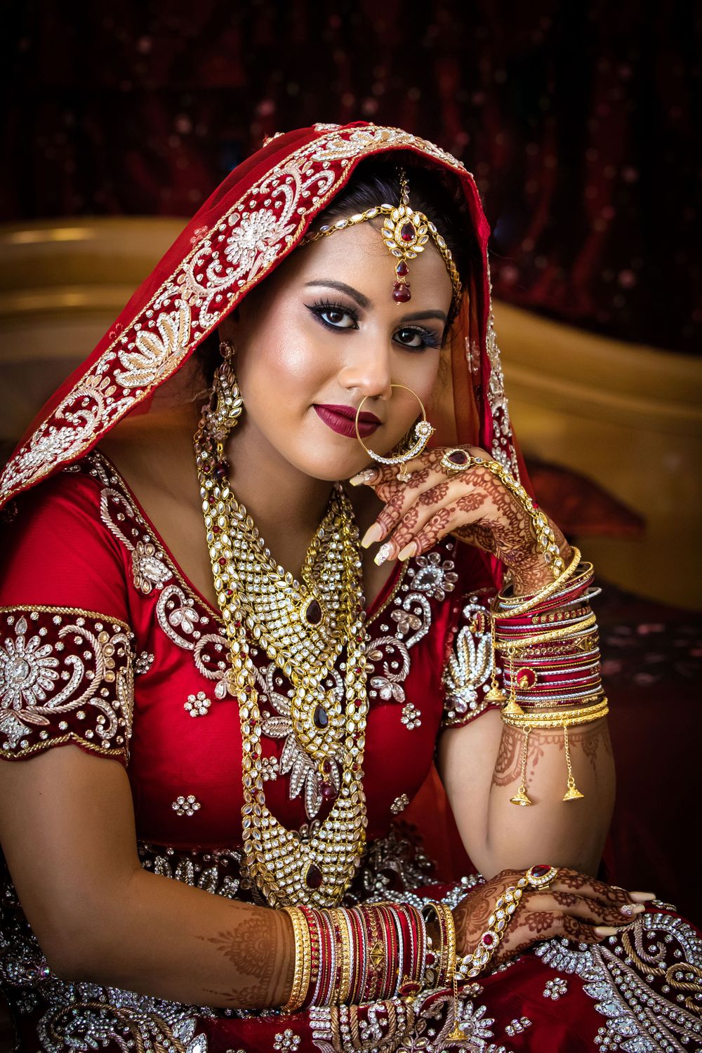 Artistic bridal portrait showcasing traditional Indian wedding attire and jewelry.