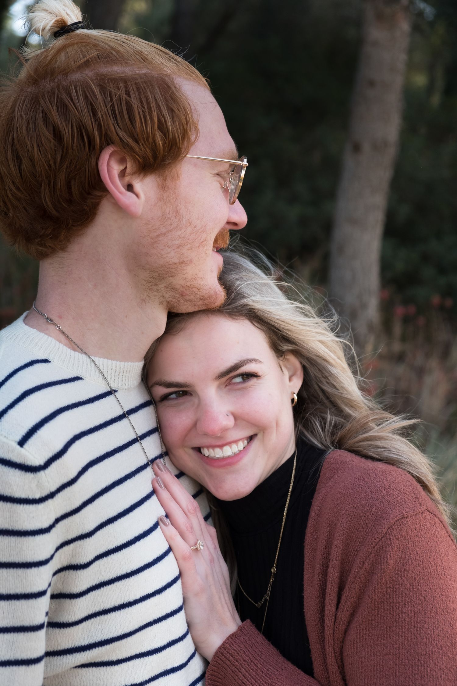 Couple embracing on their engagement photo shoot in Barcelona