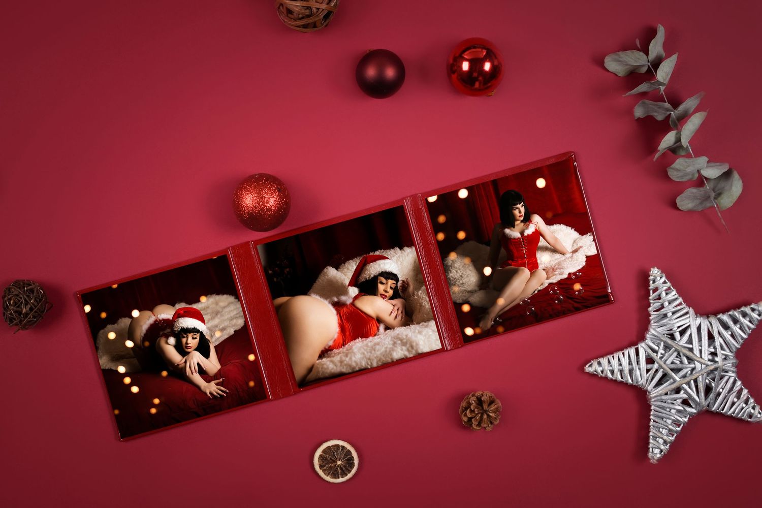 Red Christmas themed flatlay with pinecones and decorative stars on burgundy background.
