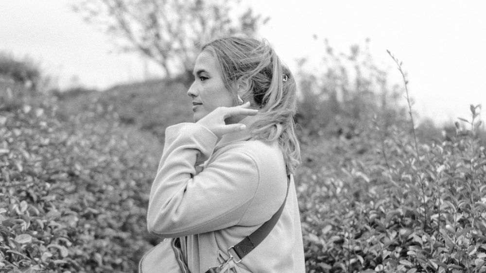 Young woman posed with hair in the wind in France