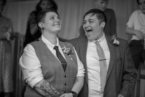 A joyful black and white moment captured during a celebration.