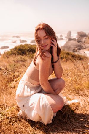 Sun-drenched coastal portrait with ocean views in golden afternoon light.