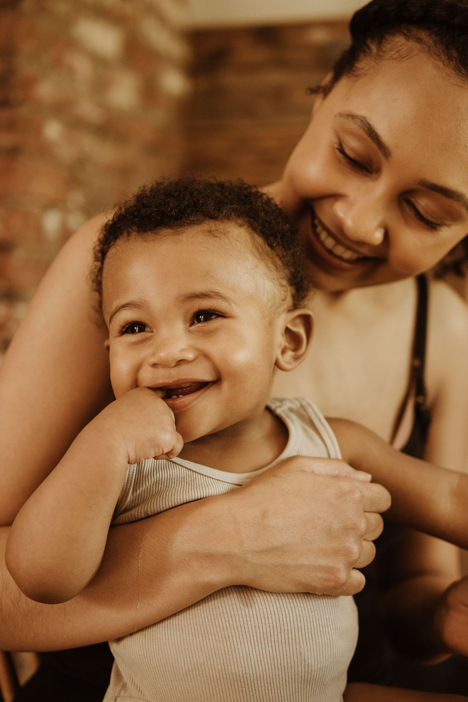 baby laughing with mum
