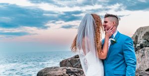 bride and groom on cliff in York Maine