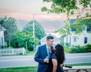 Couple kissing at sunset wedding in Bailey Island Maine