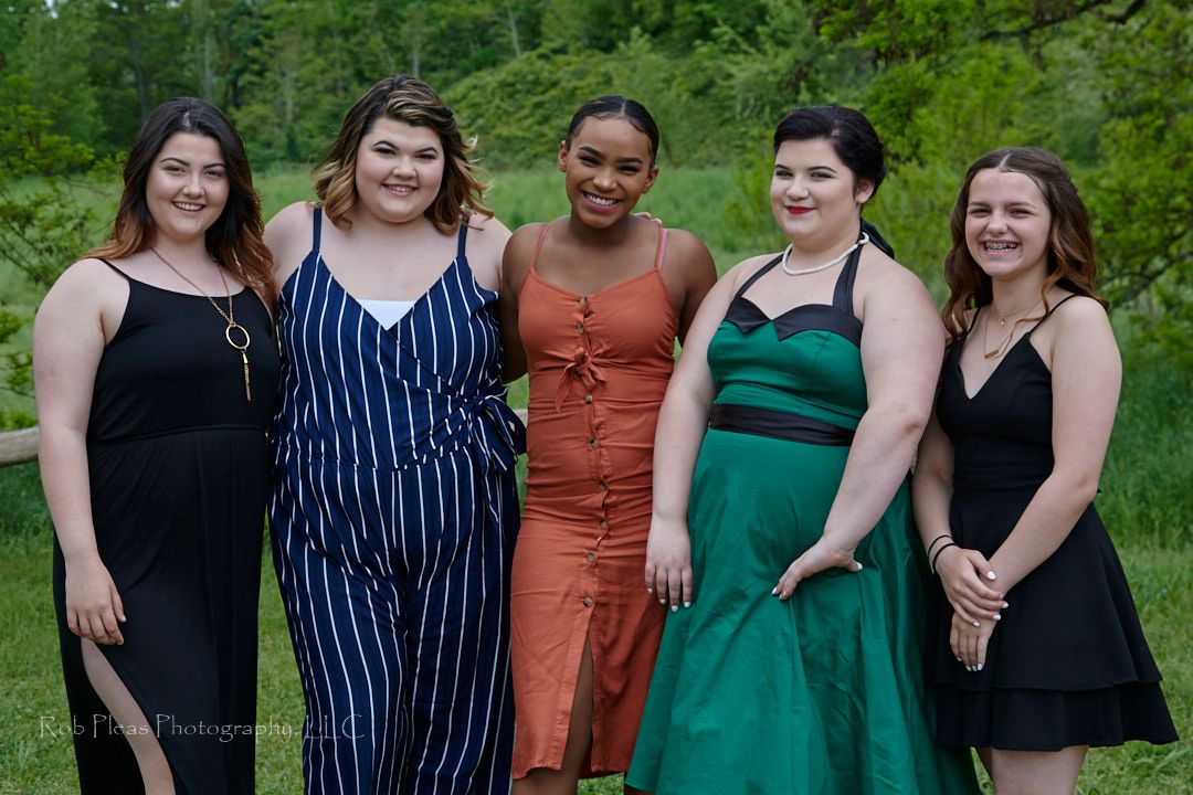 Wedding at Fort Steilacoom Park, Lakewood, WA.  Bridesmaids in highly colored dresses.