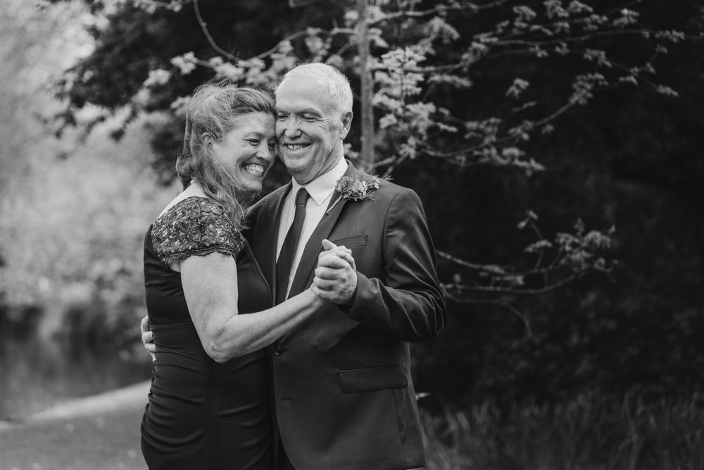 happy couple dancing at st. stephens green park