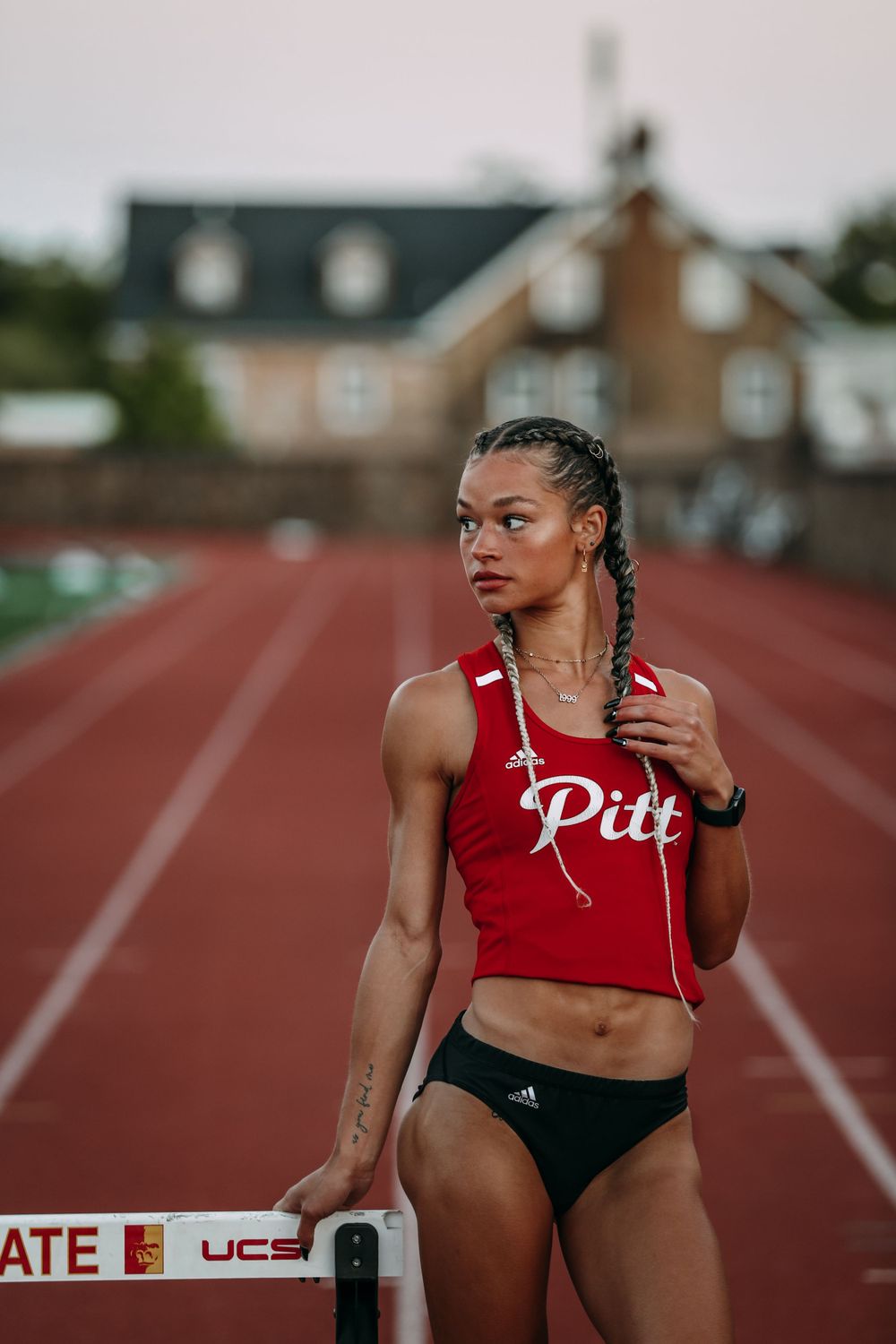 Maddy Burt on the Track in Uniform