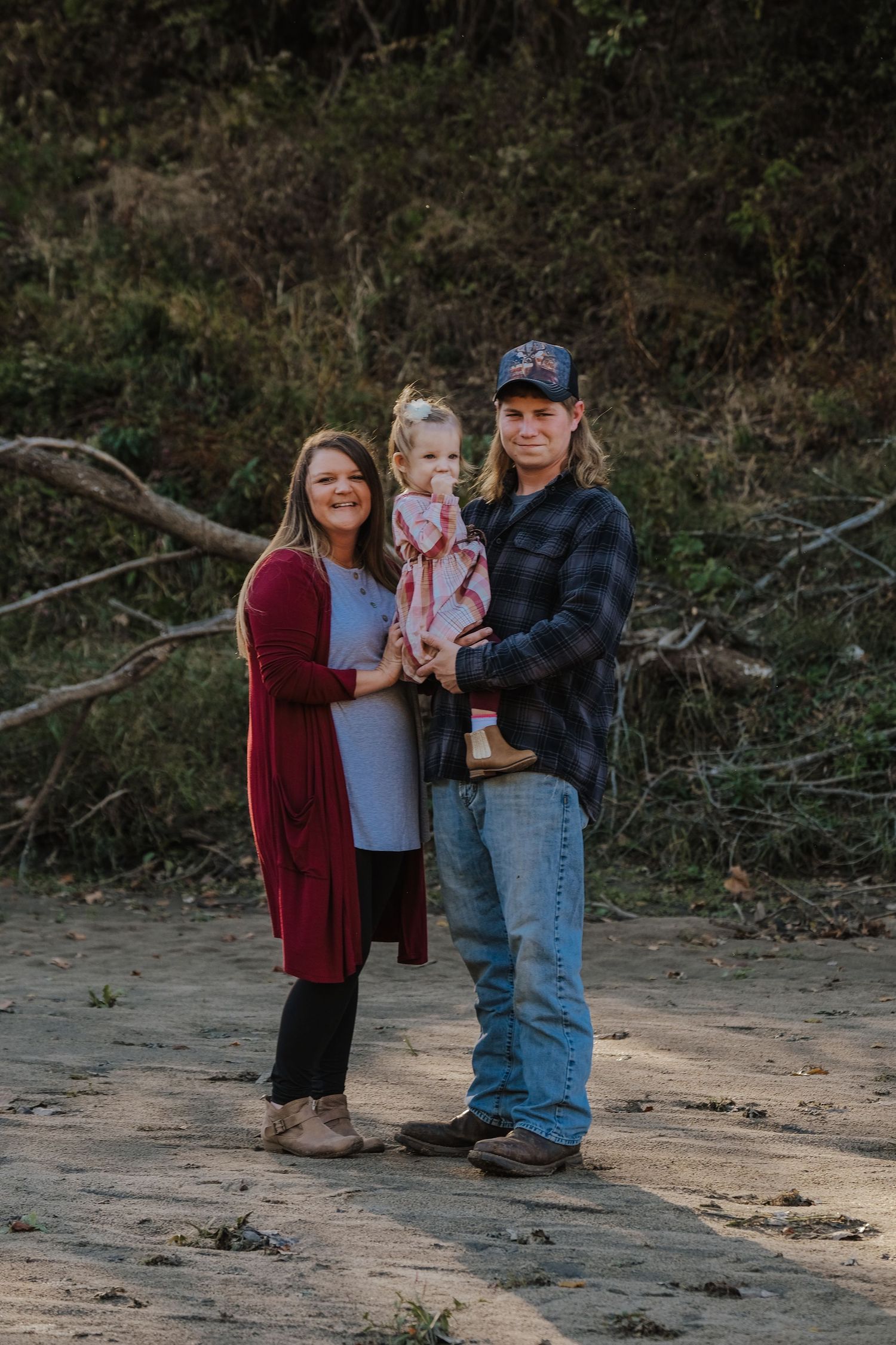 Family poses together for a family photography session in Joplin, Missouri.