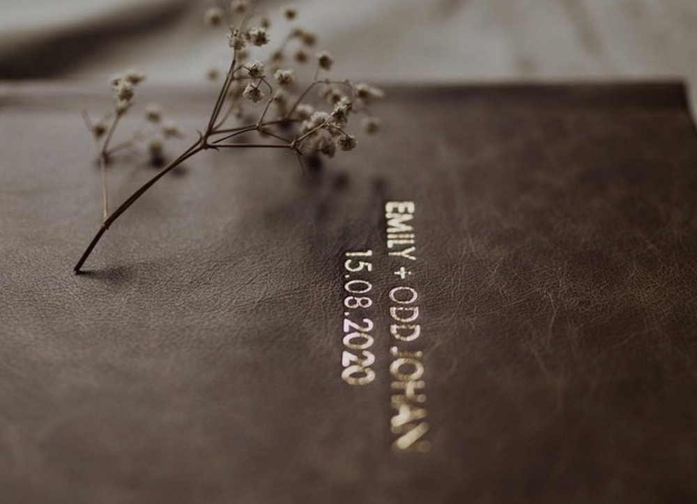 Close-up of dried flowers and botanical elements arranged on a dark surface.