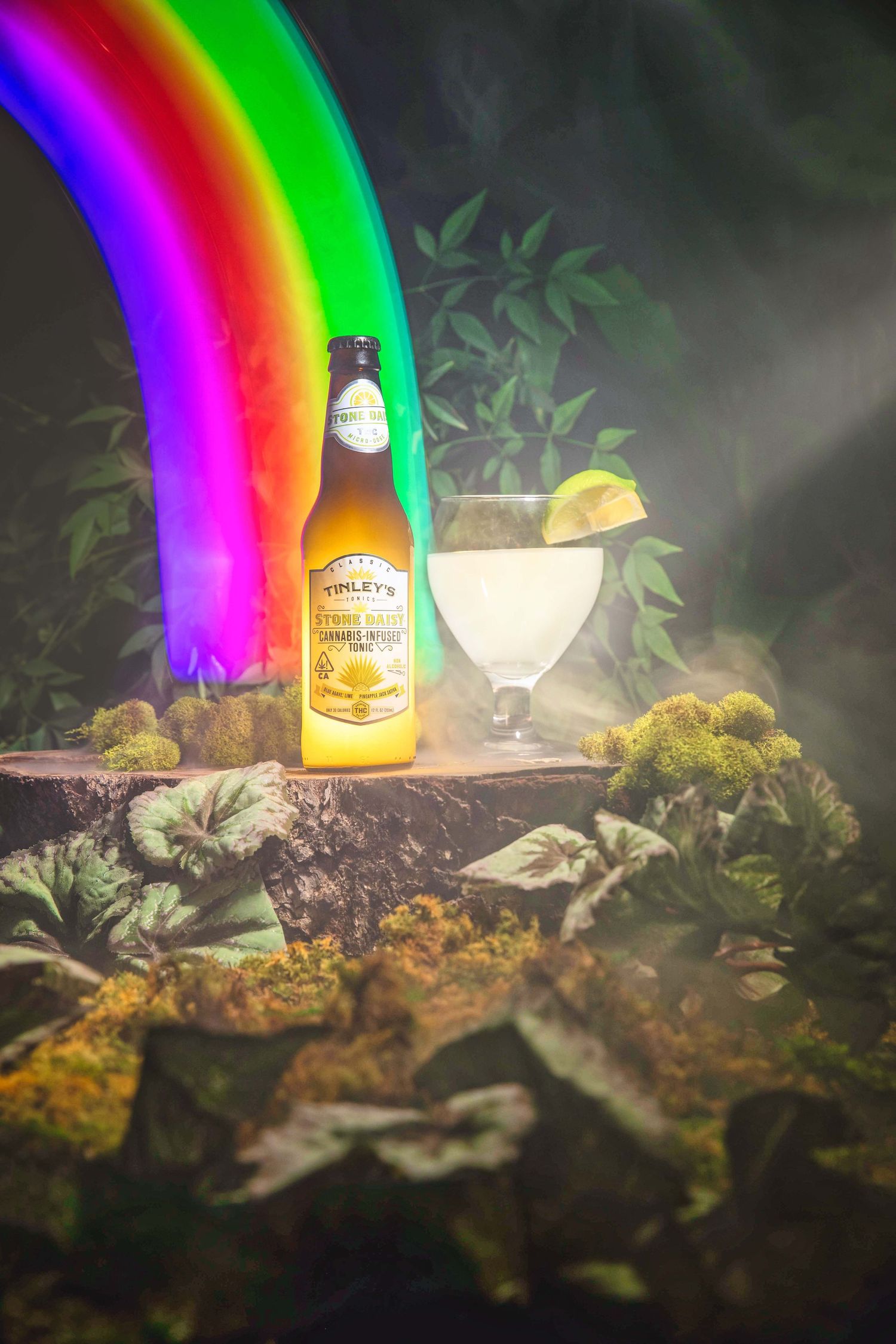 Tinley's citrus craft beer bottle with rainbow, misty forest, and margarita glass.