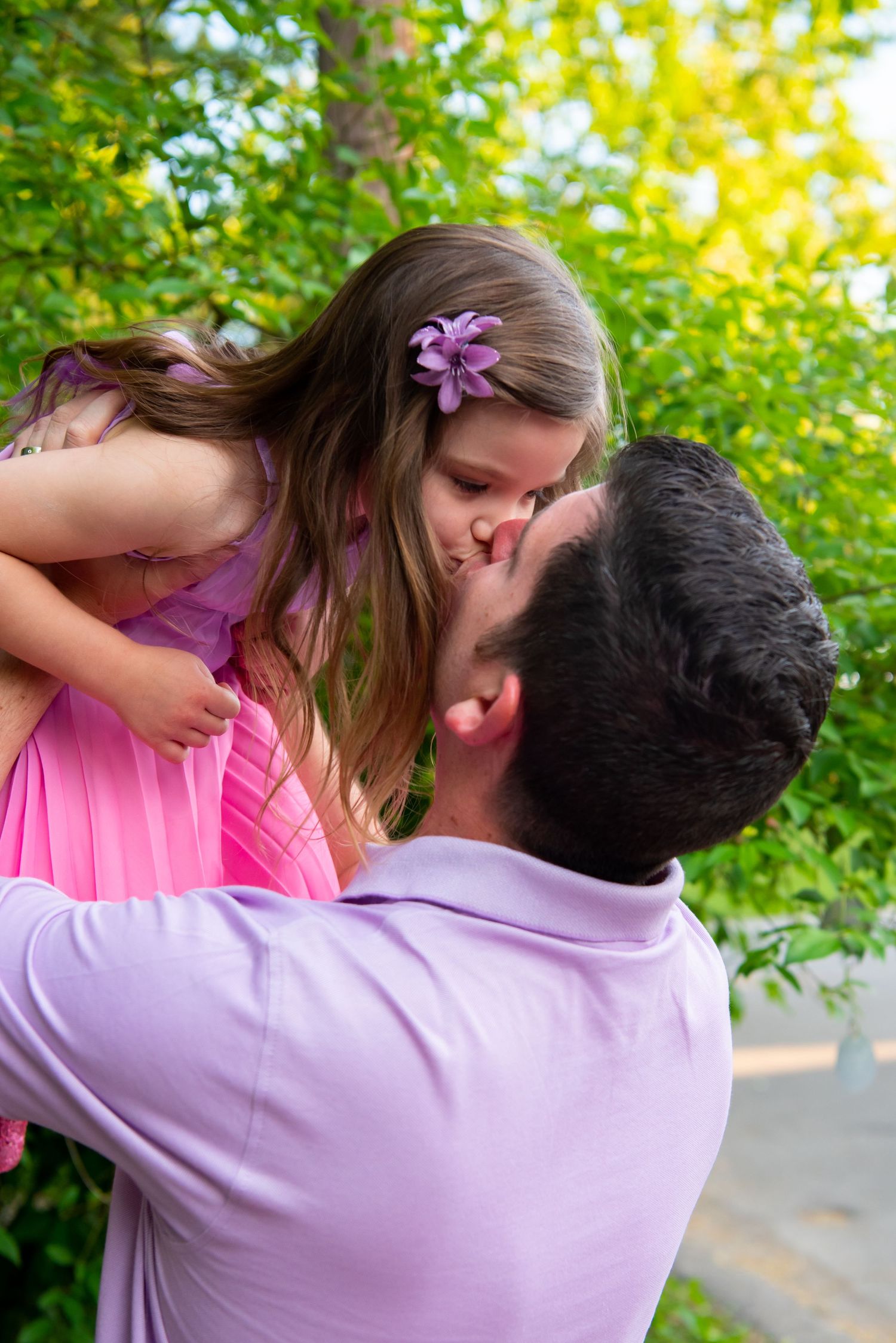 dad holding daughter