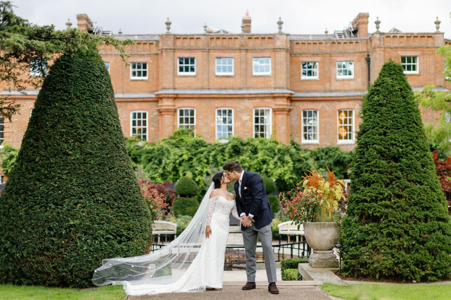 Newlyweds kissing at the Grove Hotel, Hertfordshire, UK