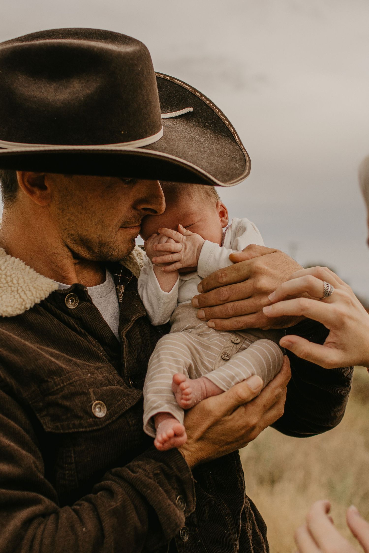baby in dad arms