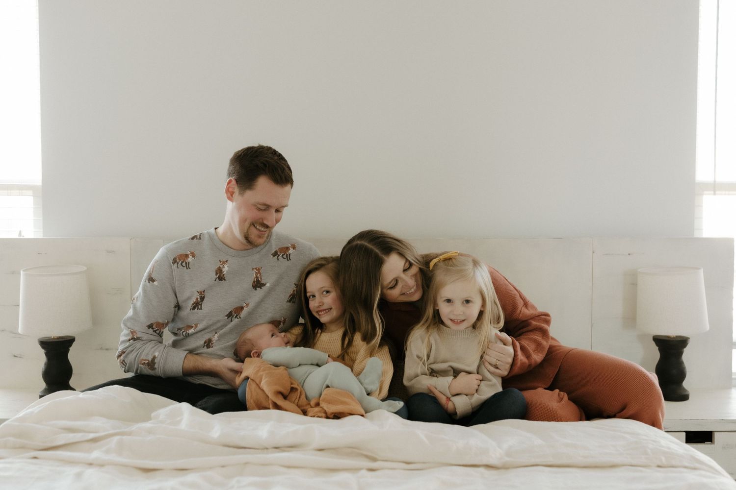 Candid family portrait in Joplin, Missouri captured in natural light by Modern Moods Imagery, showing genuine connection and movement.