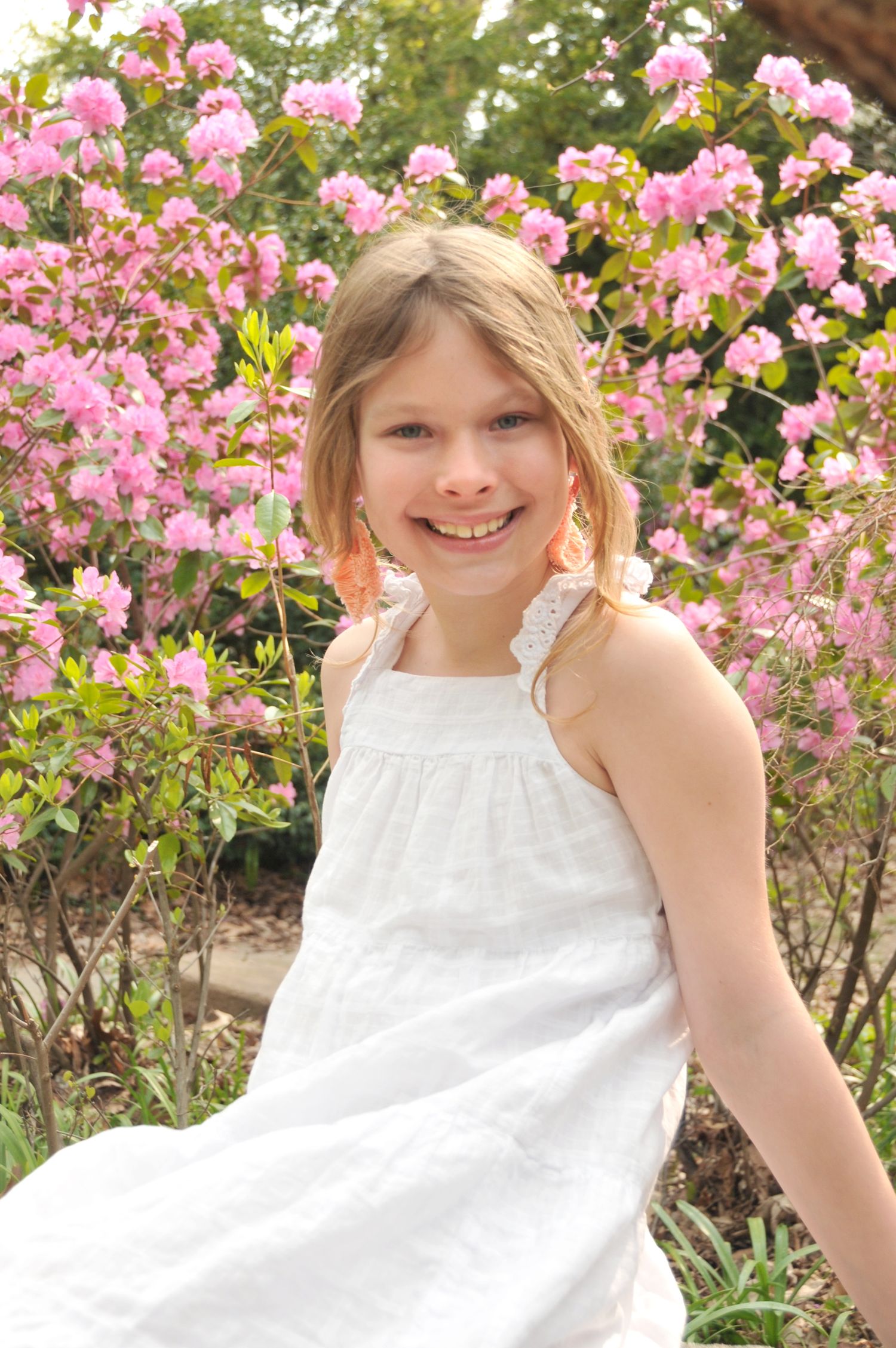 Young girl in color picture with pink flowers