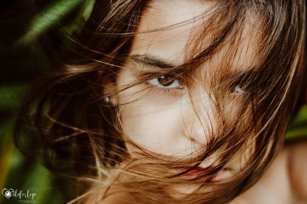 little girl with hair in the wind