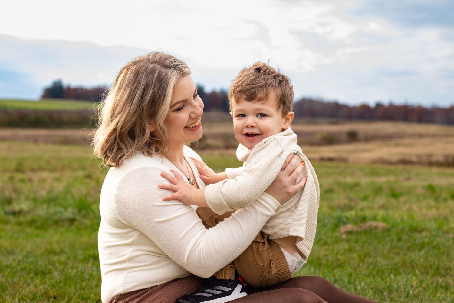 Mommy & Me Photos. Sweet candid moment between parent and child in an autumn field. Nashua Photographer Southern NH