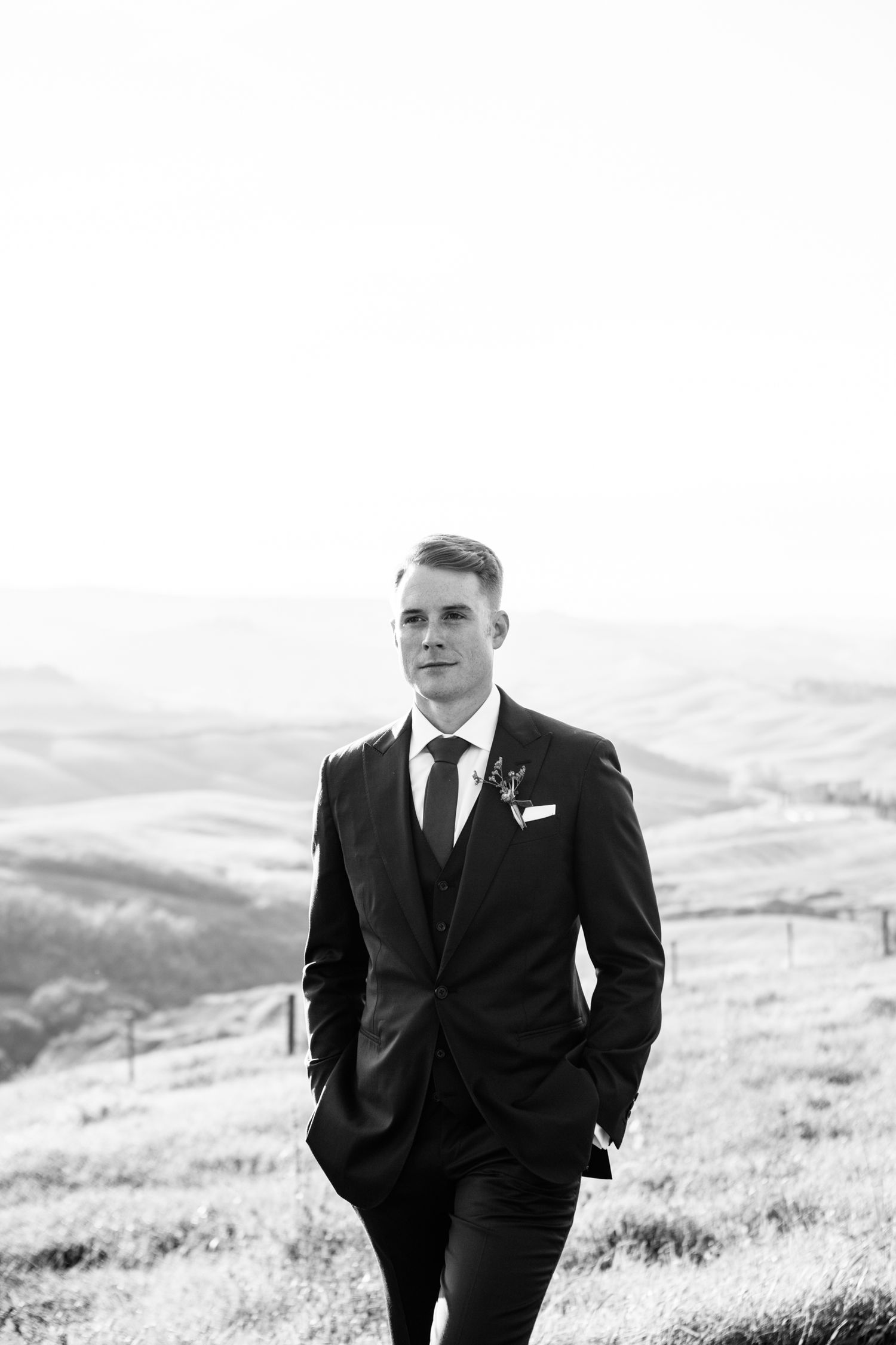 Black and white photography of groom at his destination wedding near Siena.