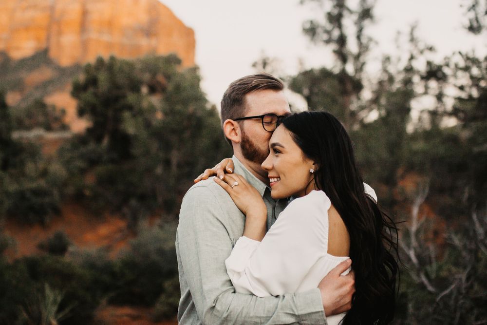 Intimate moment captured against Arizona's iconic red rock landscape.