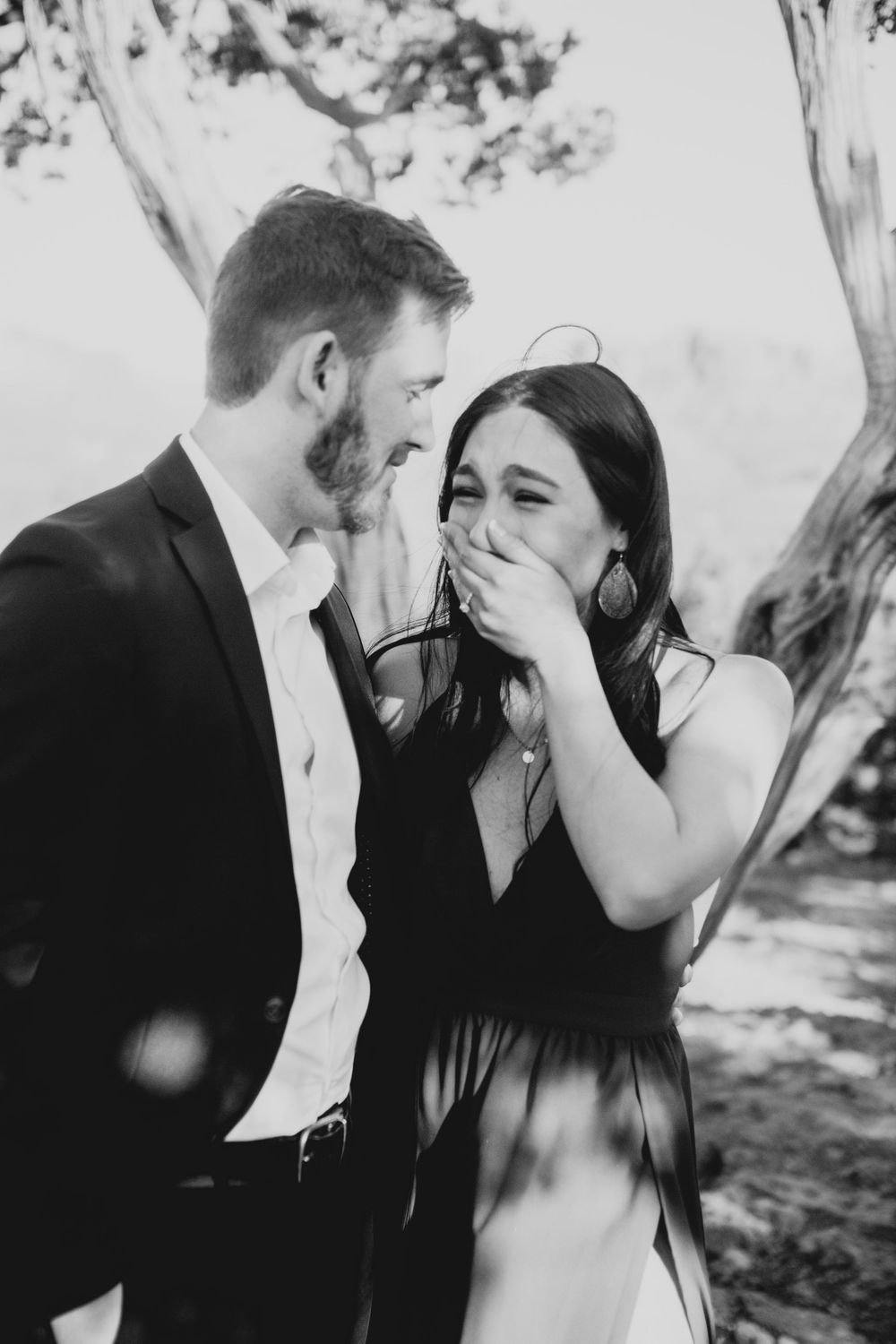 Intimate black and white photographs show tender moments during a proposal.