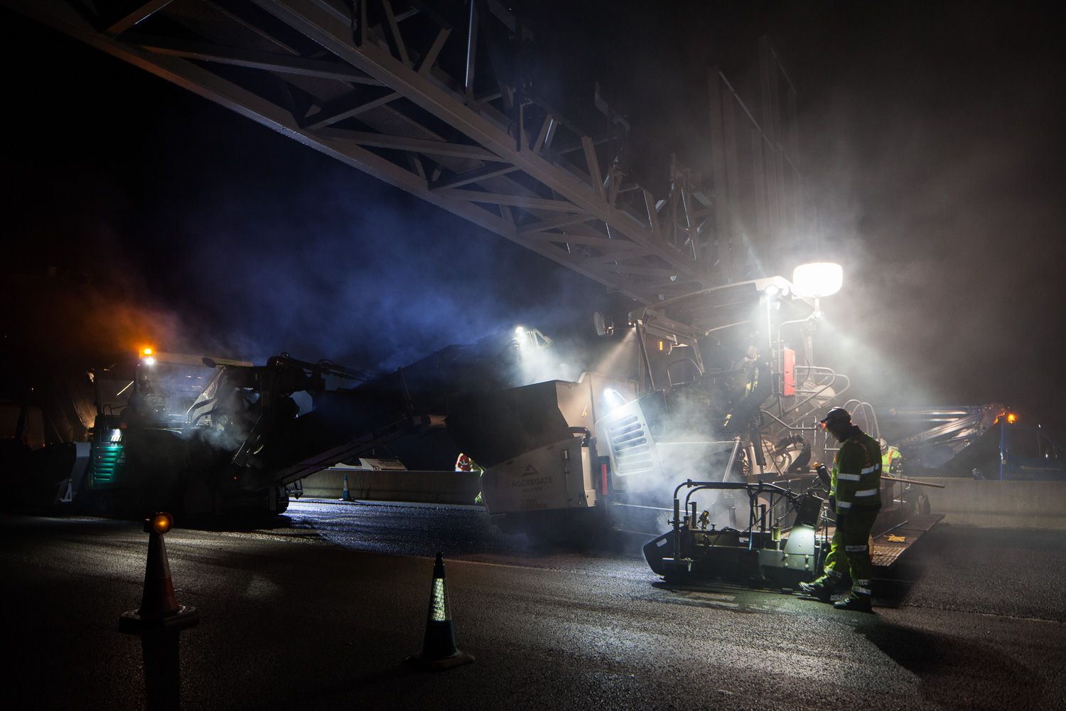 Construction photograph of black top on M1 Motorway construction workers night work