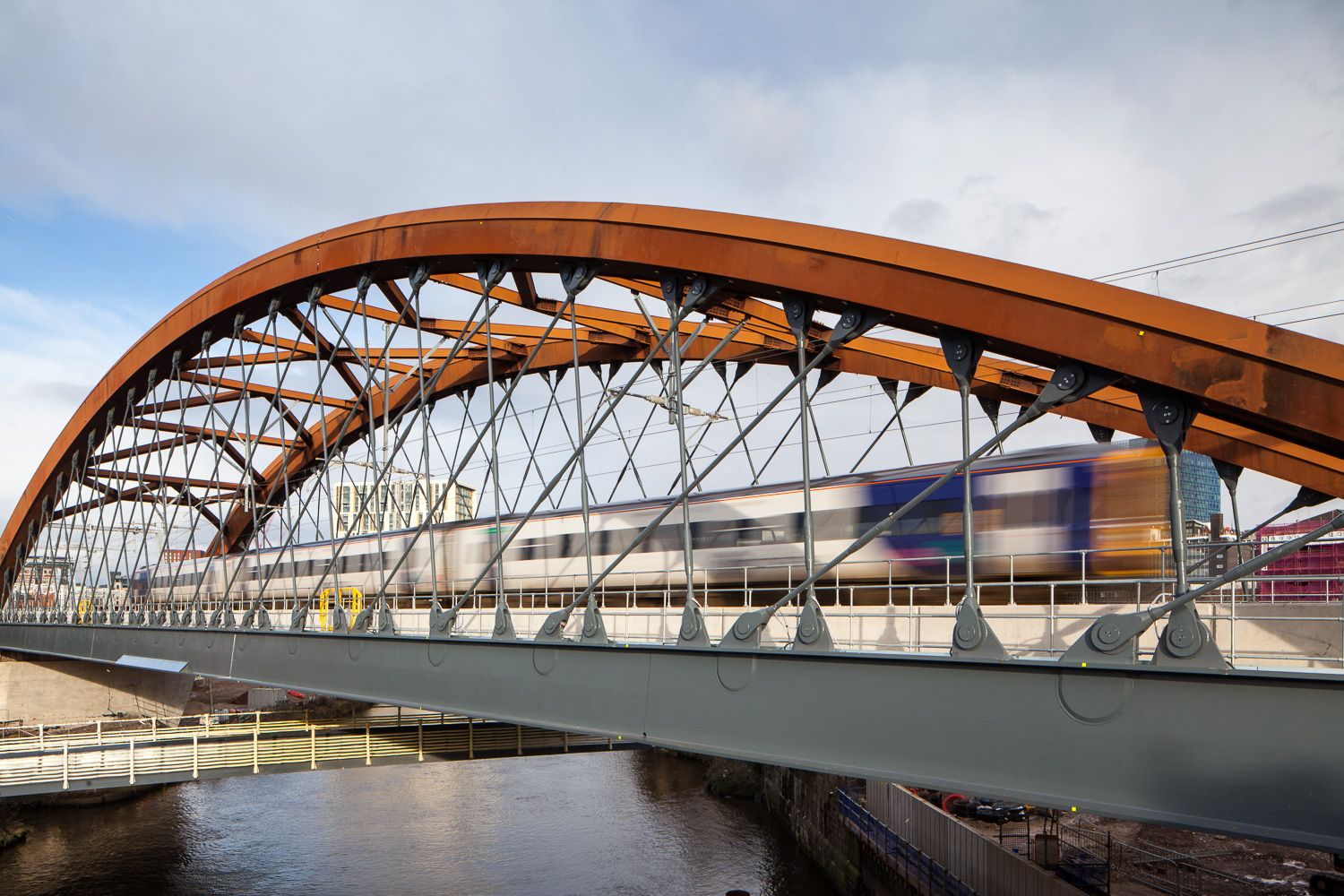 Train over Ordsall Chord Bridge Manchester after construction
