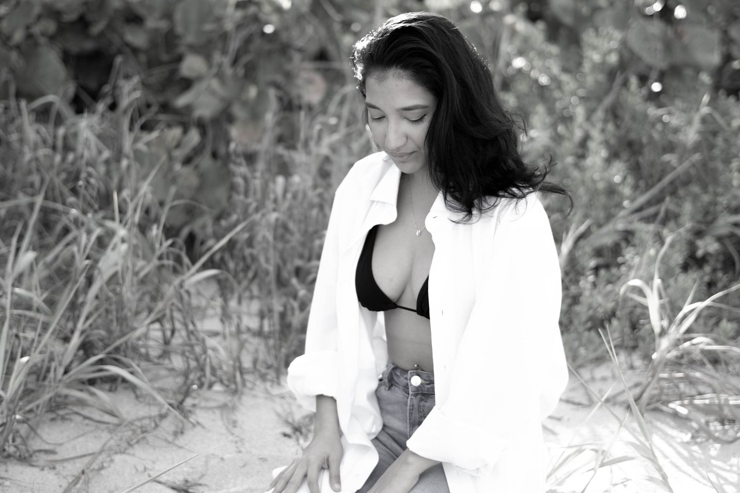 Dark haired girl posing in Boynton Beach at sunset