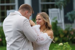 Groom kissing his brides's hand
