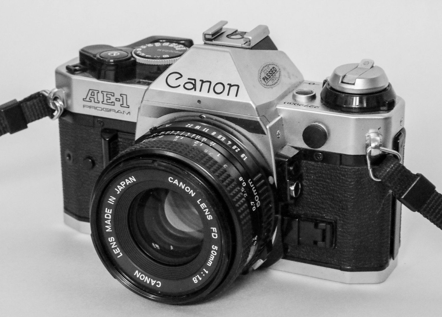 Photo of AE-1 Canon SLR camera in black and white