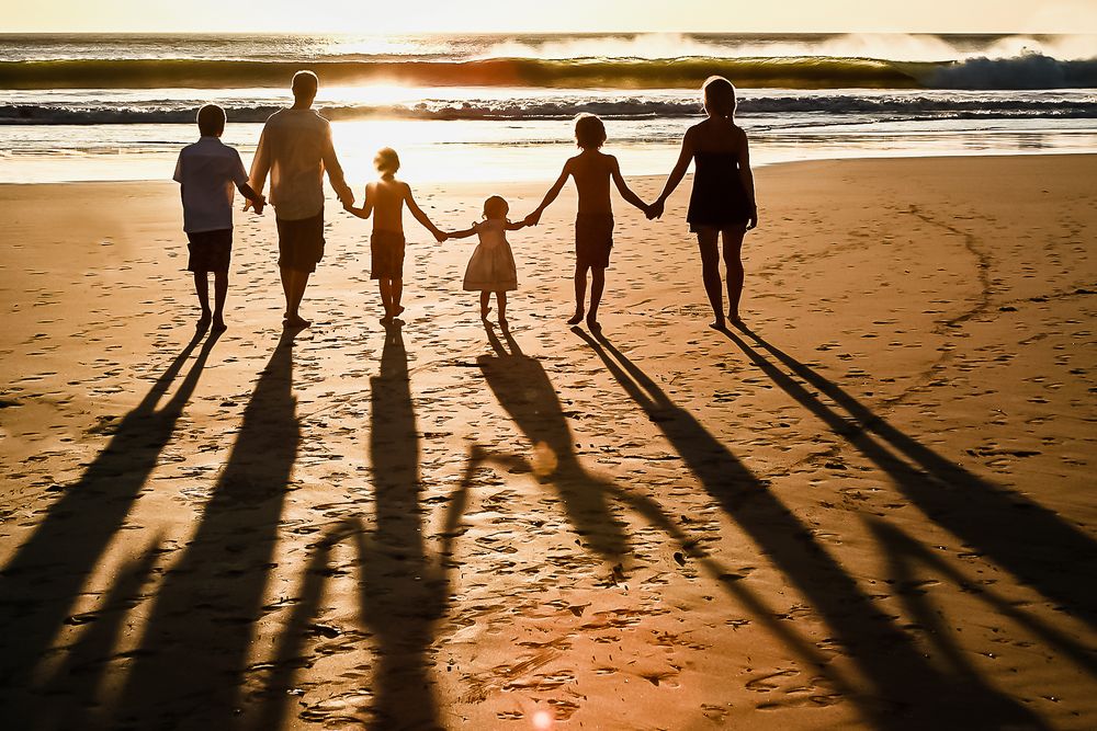 Family photographer in avellanas beach at sunset