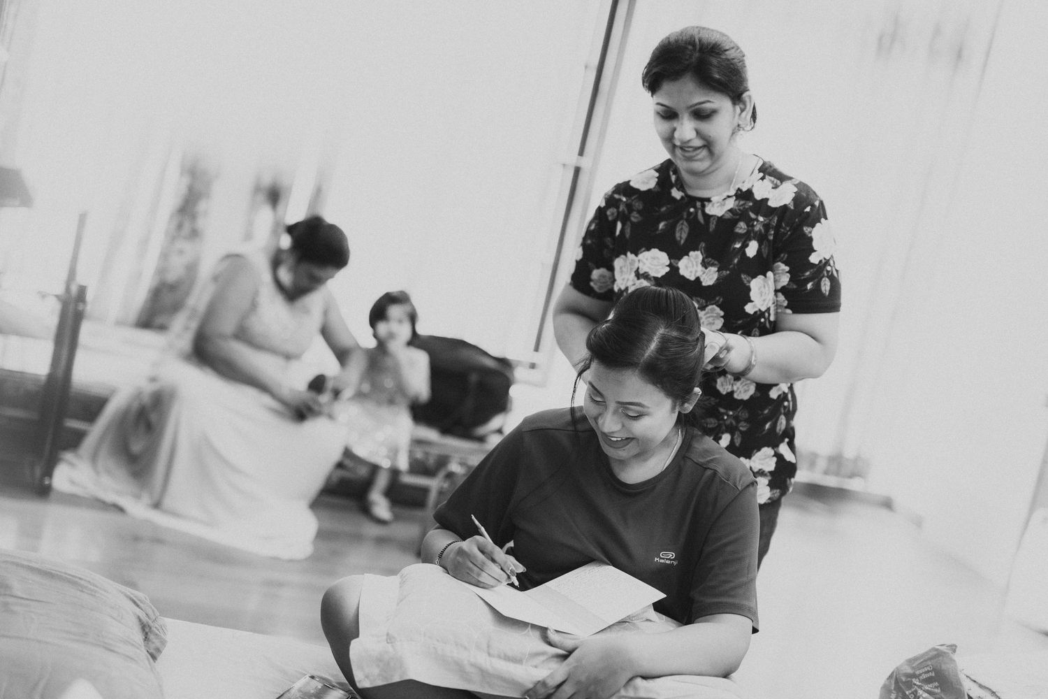 Black and white candid moments captured during celebration.