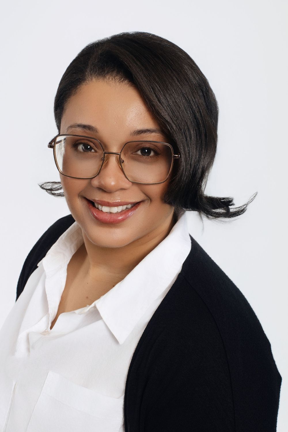 Professional headshots showing warm smiles and business attire against white background.