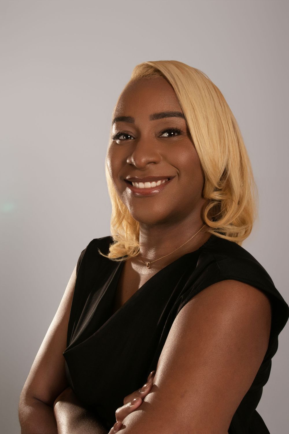 Professional headshots showing warm expressions and styled blonde hair against neutral backdrop.