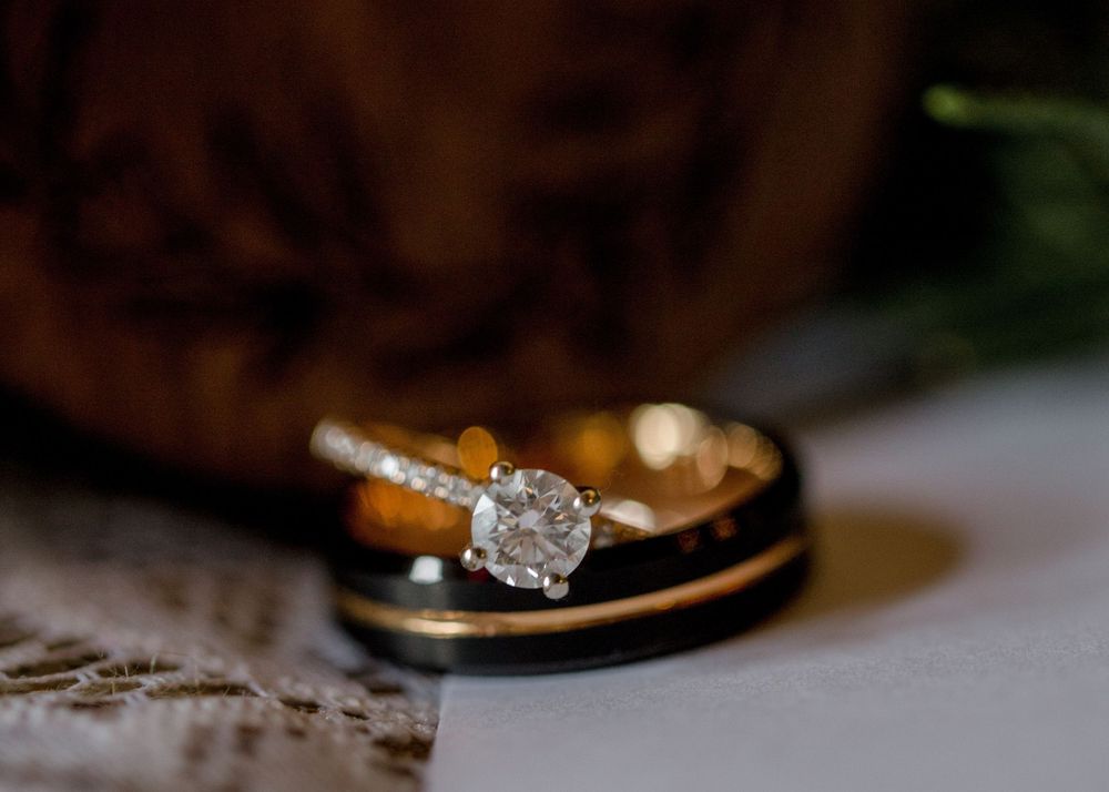 A series of elegant engagement ring photos showing diamond solitaires in gold settings against blurred backgrounds.