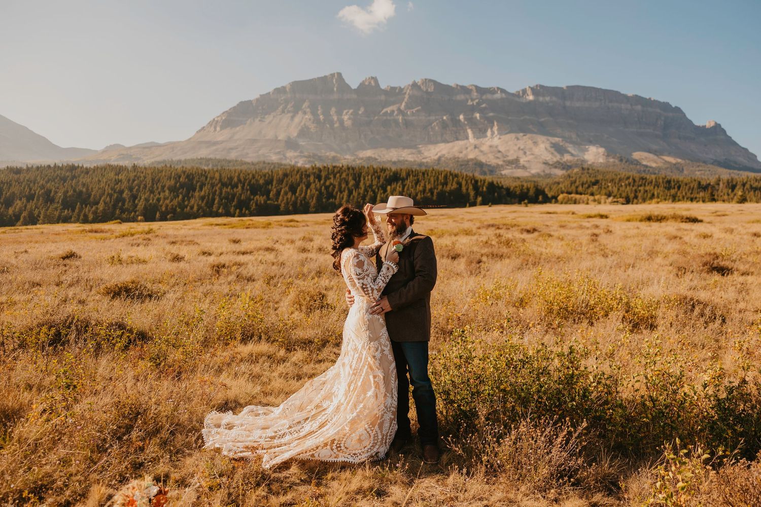 Glacier National Park Elopement Photographer captures National Park Elopement in East Glacier. Western Bride and groom elope in Glacier