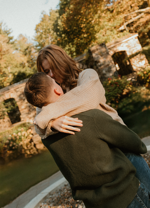 A series of intimate embraces captured in warm autumn sunlight against a natural outdoor backdrop.