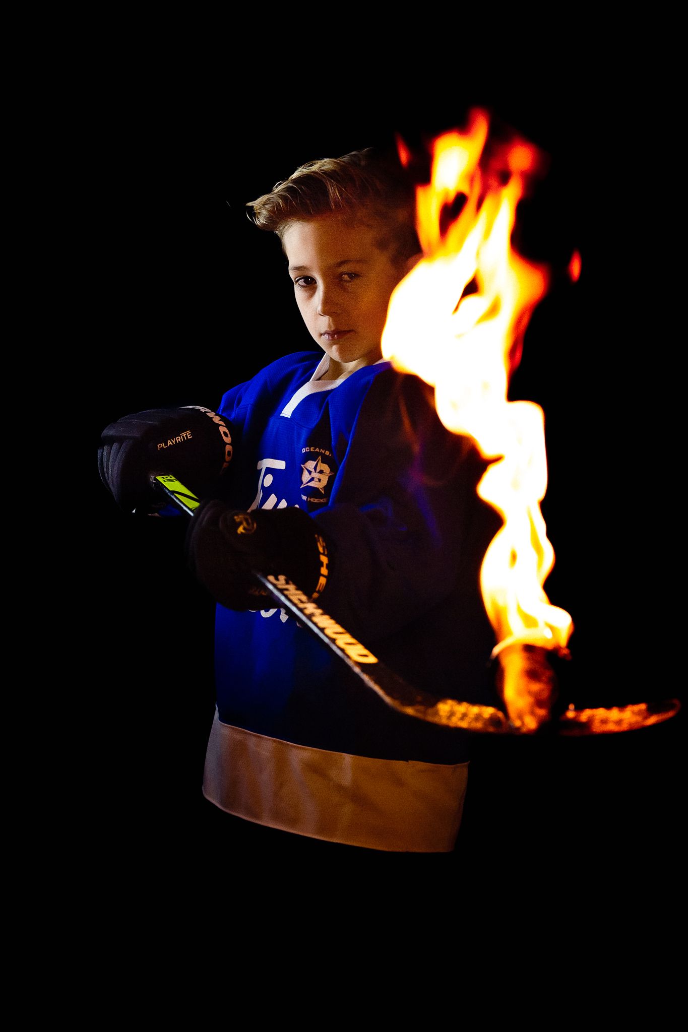 Vancouver Island youth hockey  – player with fire portrait