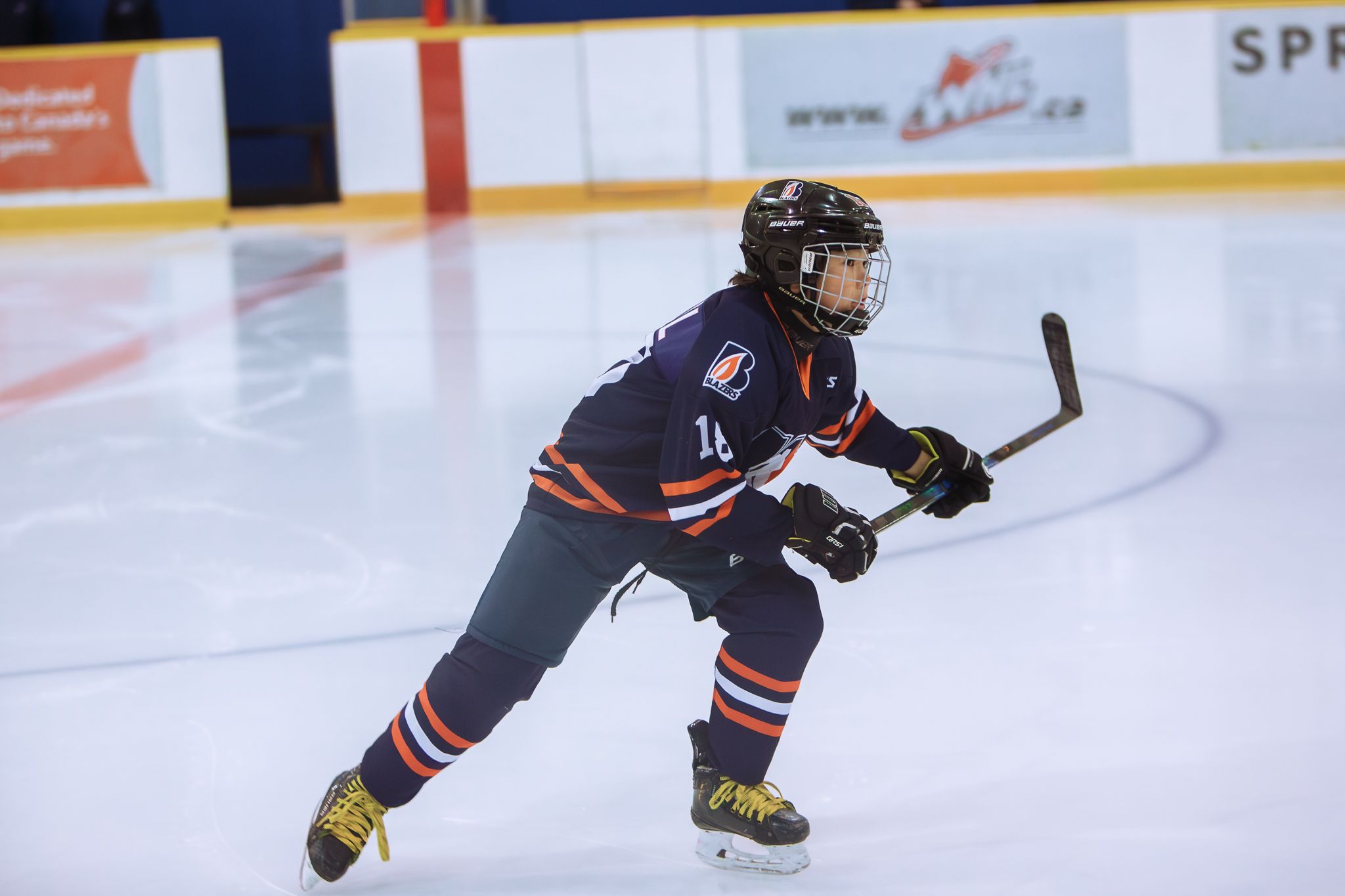 Youth hockey players competing in Vancouver Island game – sports photography