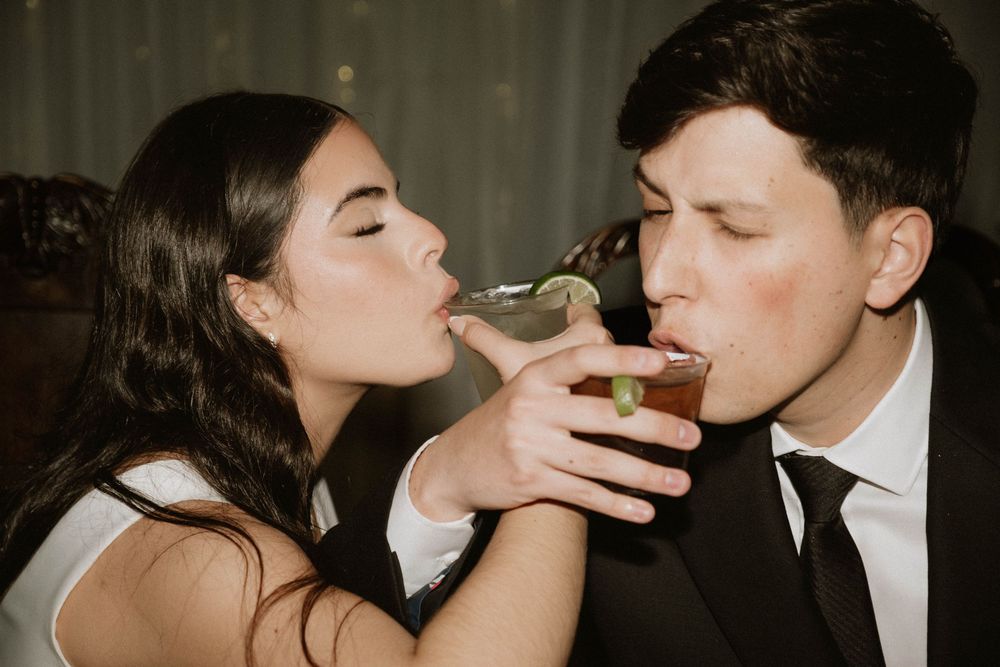 A romantic wedding photo sequence showing tender kisses and intimate moments between a couple in warm lighting.