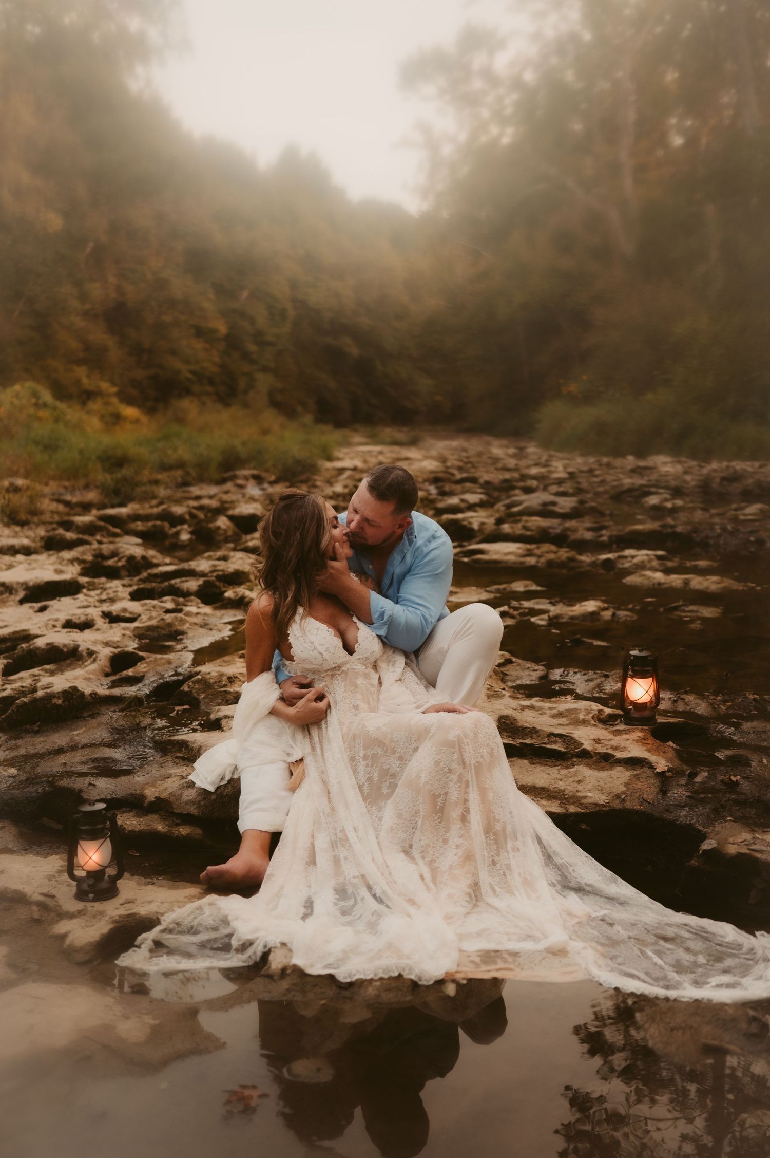 Indiana Couples Storytelling Photographer // Romantic couple session on rocky riverbed with flowing white dress and moody fog.