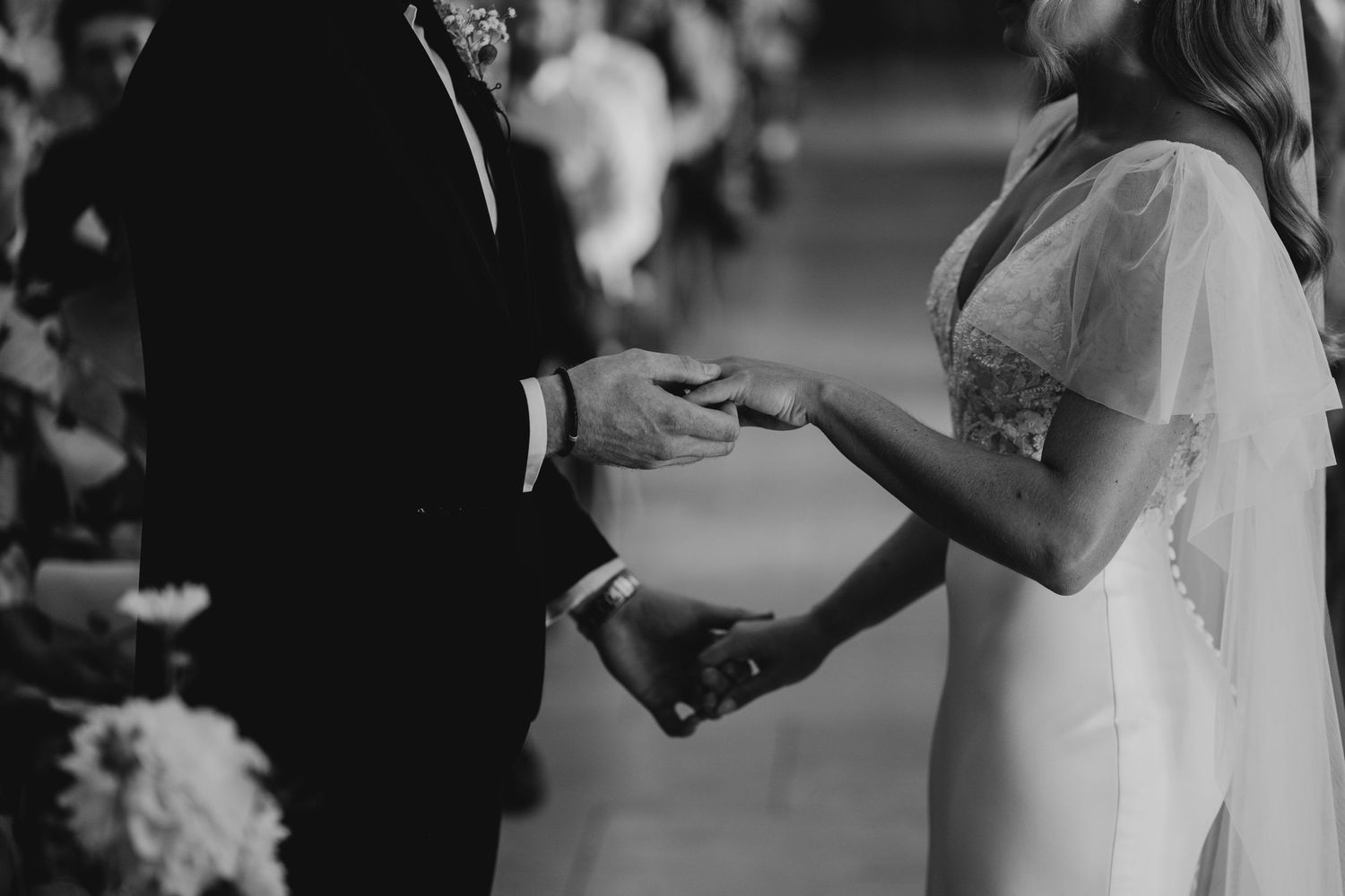 A series of black and white wedding photos showing couples dancing and embracing during a celebration.