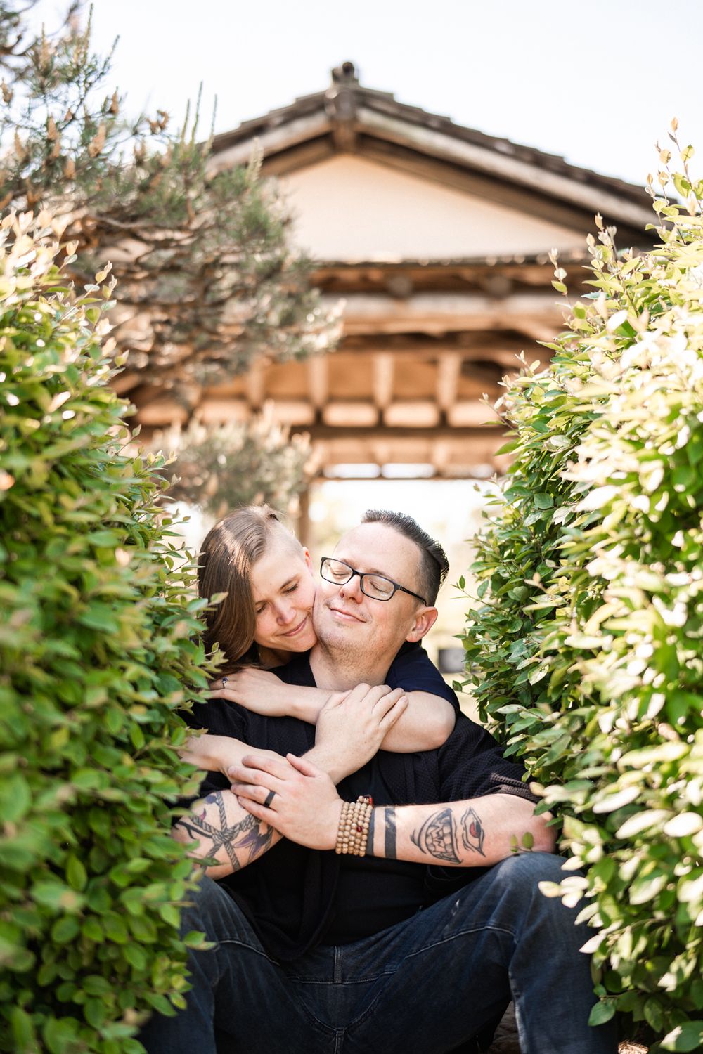 Engagement couple kissing in the Japanese Garden at the Chicago Botanic Garden.