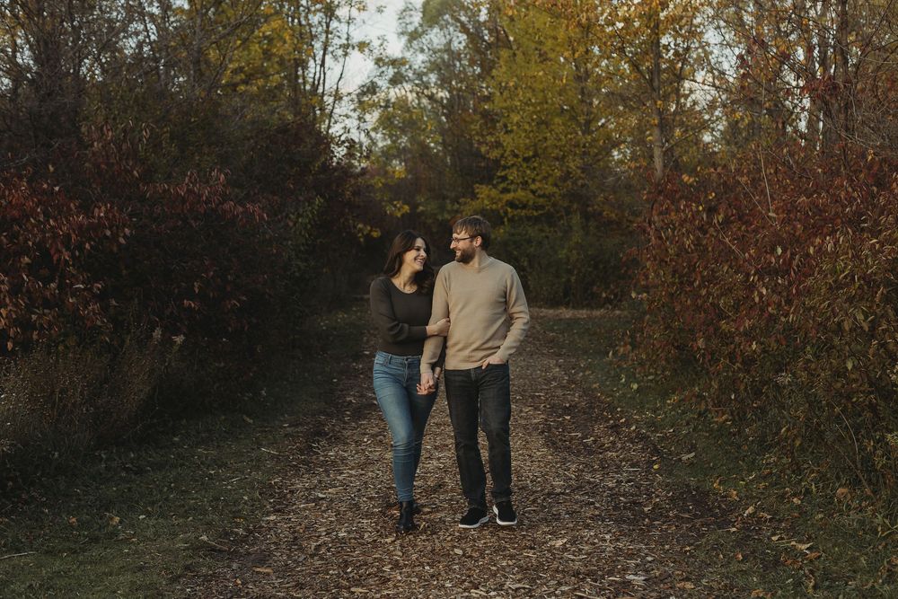 A series of autumn outdoor photos showing people walking along a wooded trail surrounded by fall foliage.