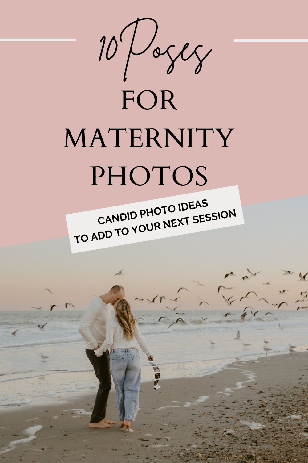A couple walks along a sandy beach at sunset with seagulls flying overhead in a romantic maternity photoshoot setting.
