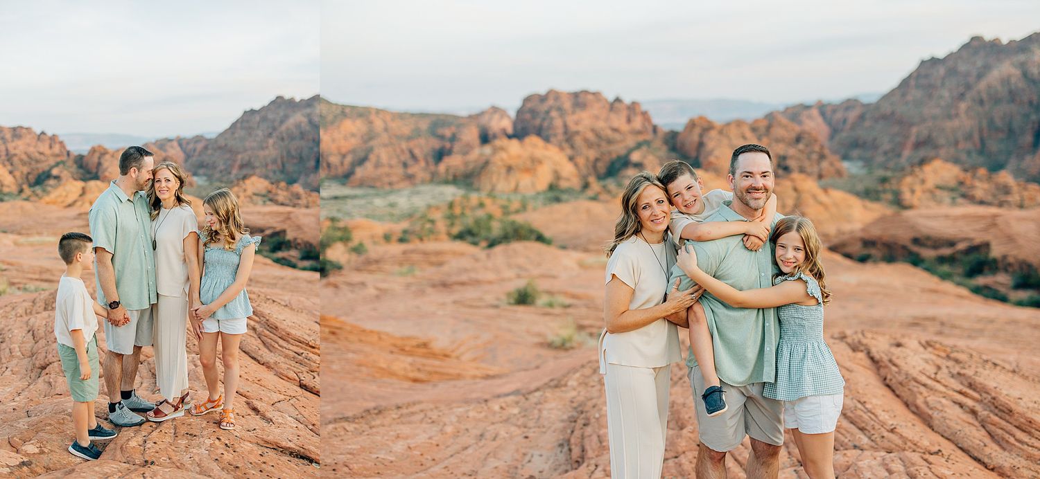 A panoramic view of desert rock formations with people gathered for photos along the sandstone cliffs.